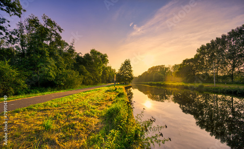 Sunset light playing with the rural landscape of Noord-Brabant, The Netherlands. The canal is called Wilhelminakanaal.