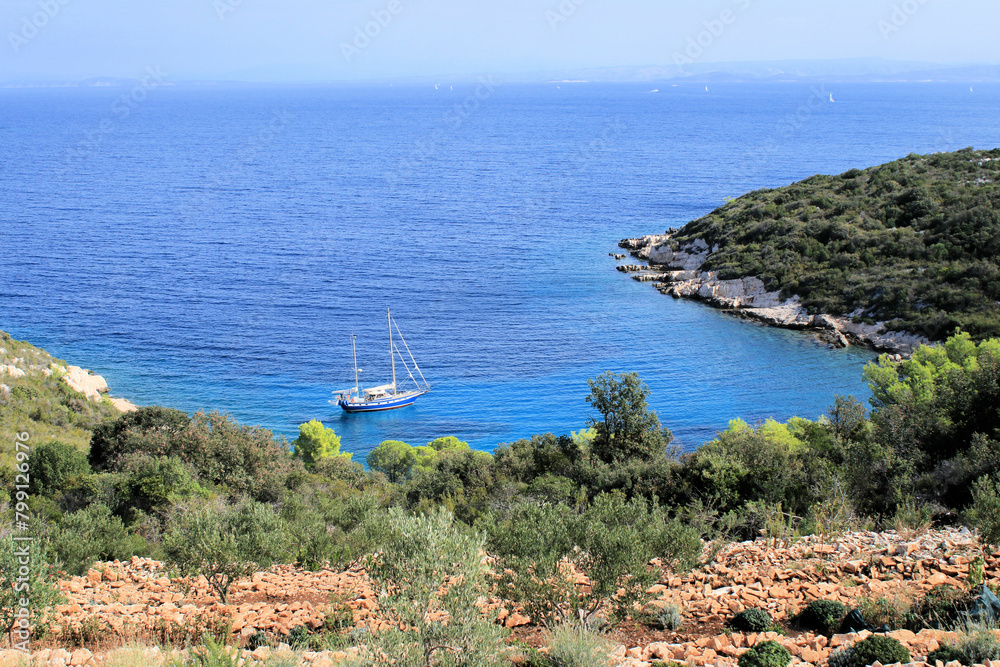 sailing boat in a blue bay, island Vis, Croatia