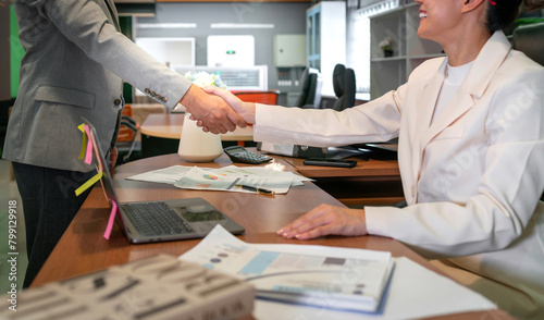 business woman greeting man for interview or deal. human resource recruit new employee for job position with happy welcome. a female office woman shaking hand with customer for company partnership