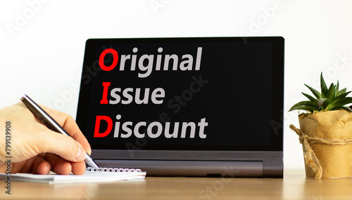 OID original issue discount symbol. Concept words OID original issue discount on beautiful black tablet. Beautiful white background. Business OID original issue discount concept. Copy space. © Dzmitry