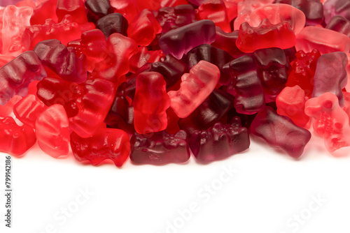 Assorted red gummy candies. Jelly bears.