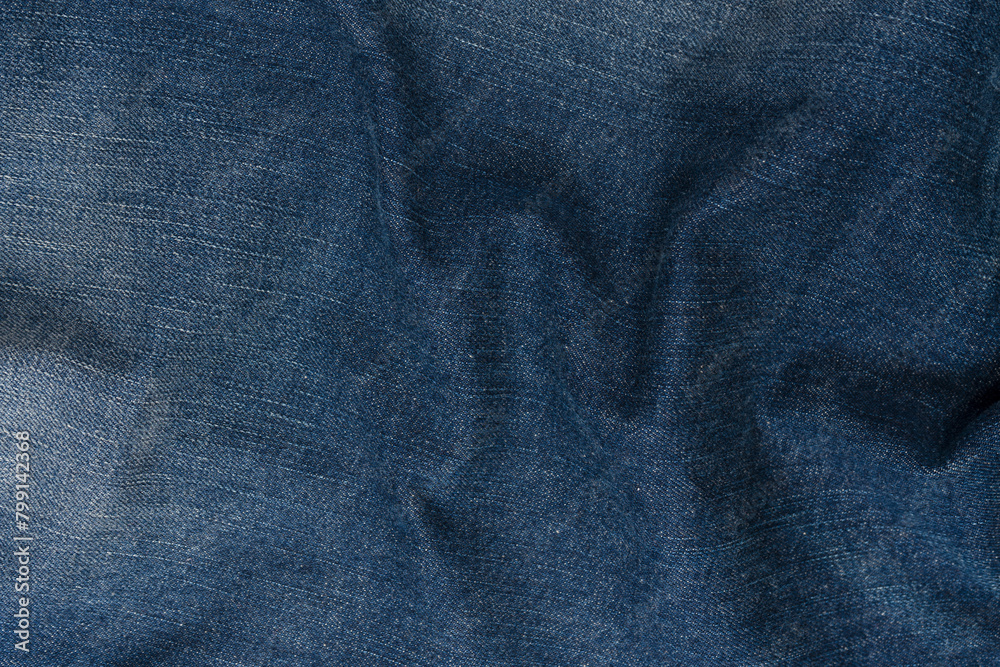 Blue jeans denim texture as a background. Top view. Blue jeans denim texture as a background. Top view.