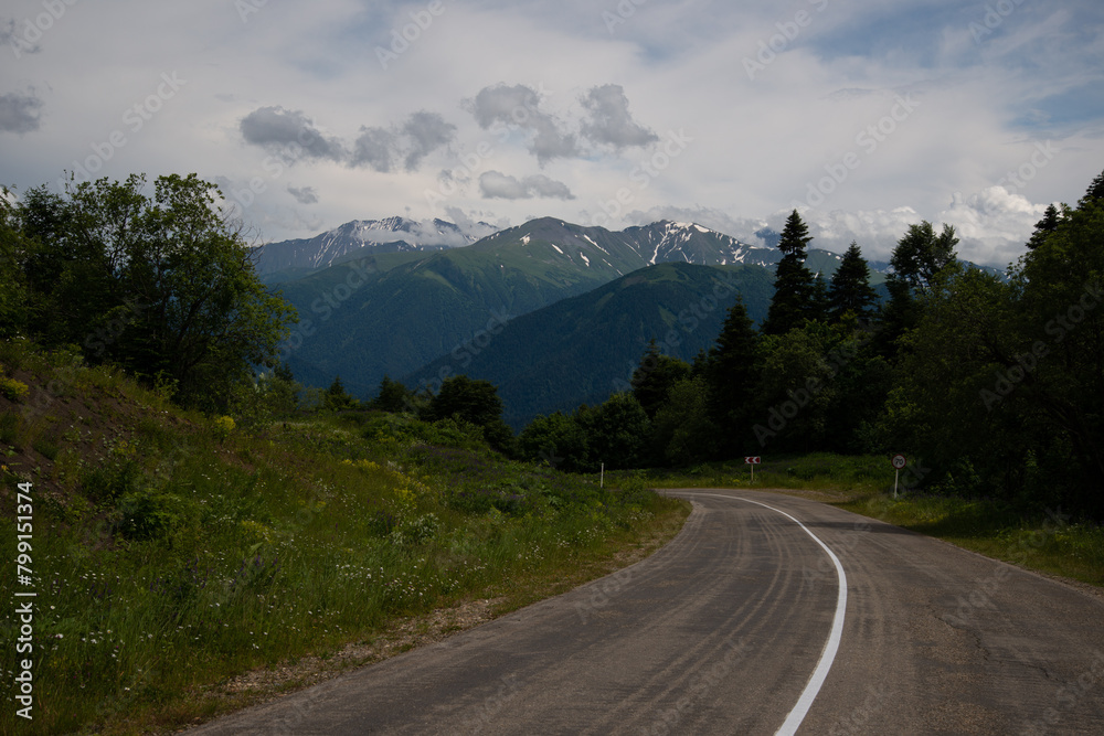 Fototapeta premium Beautiful mountain landscape in early spring and bad road.