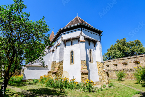 Old building of Saints Peter and Paul fortified Church (Biserica Sfintii Apostoli Petru și Pavel) in Cincosr village, near Fagaras in Transylvania (Transilvania) region, Romania, in a sunny summer day
