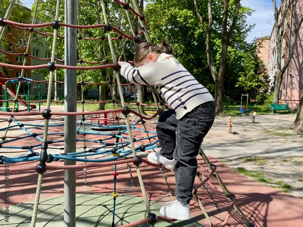 child playing on the playground child playing on the playground