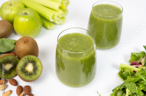 Healthy vegetable smoothie in glasses on white background.