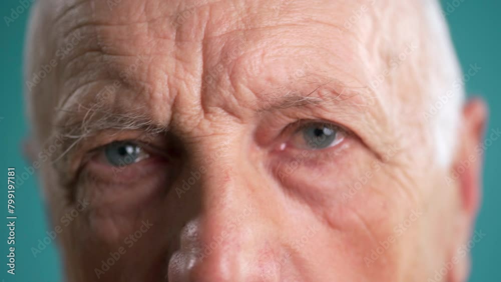 Close-up of an old man putting eyeglasses Close-up of an old man putting eyeglasses
