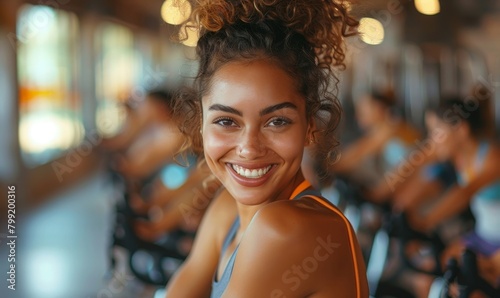 Cheerful young woman on group cycling class, Generative AI photo