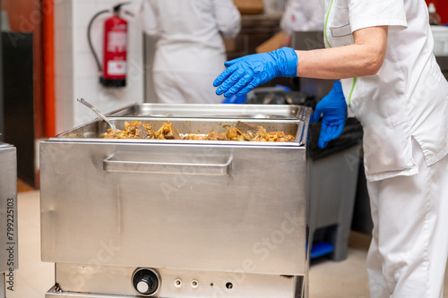 Chef preparing the self-service buffet at the restaurant. High quality photography