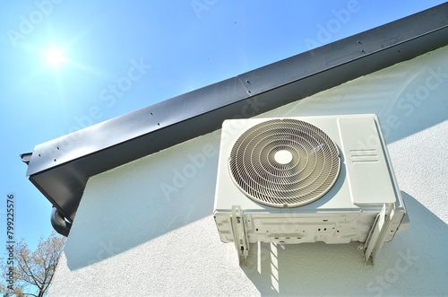 air conditioner under the roof with blue sky and sun best for business HVAC