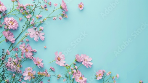 Pink small Flowers on a turquoise on copyspace Backdrop