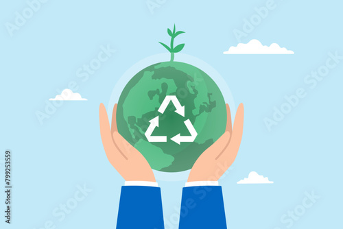 Hand holds sustainable green world with recycle symbol, illustrating ecology, and renewable energy. Concept of save the planet from climate change and global warming, environmental safety