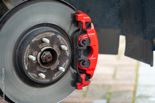 Close-up of a red sports brake caliper