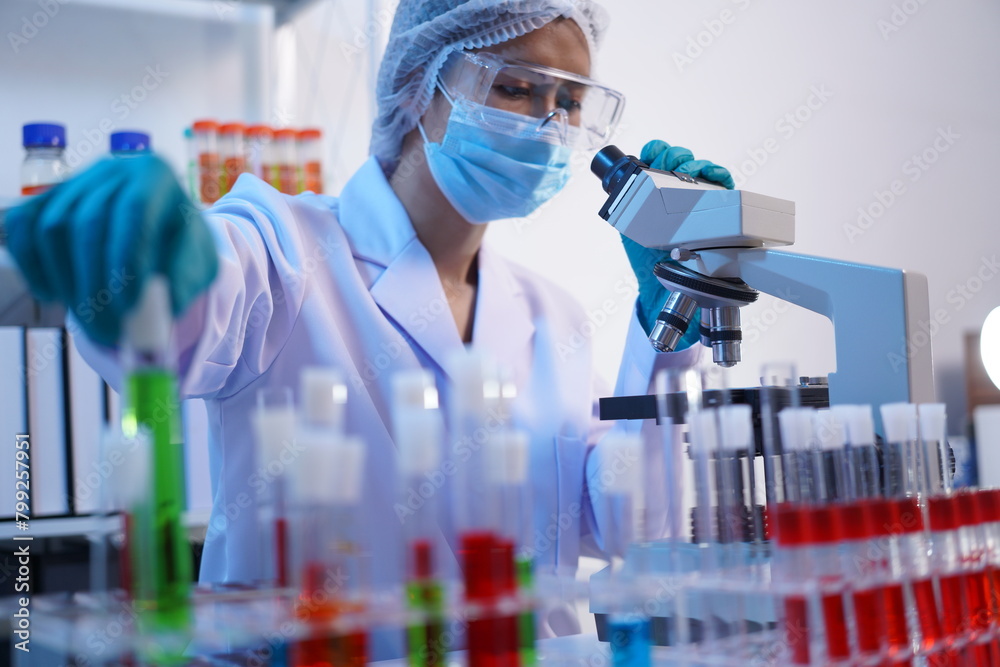 Science test tubes, laboratory equipment for new medical research, microbiology research with small pipettes in close-up. Asian and African female scientists in the laboratory, perfume samples Science test tubes, laboratory equipment for new medical research, microbiology research with small pipettes in close-up. Asian and African female scientists in the laboratory, perfume samples