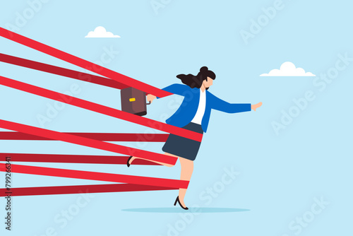 Strong businesswoman with full effort break tape barrier, illustrating gender barriers and overcoming career obstacles. Concept of inequality in the workplace, discrimination, and limitations