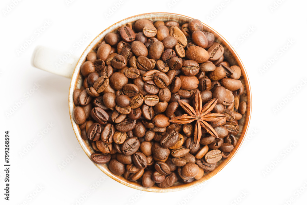 Fototapeta premium Cup with coffee beans and spices on white background. Top view