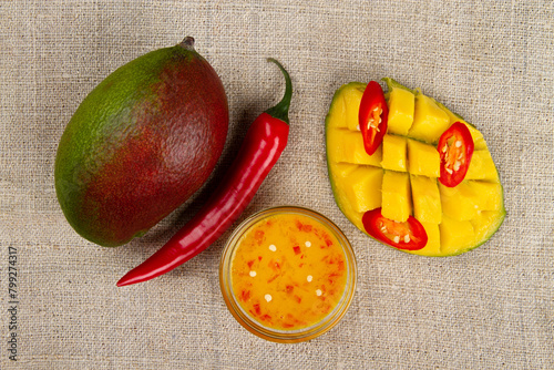 Mango chili sauce, mango and chili on burlap.