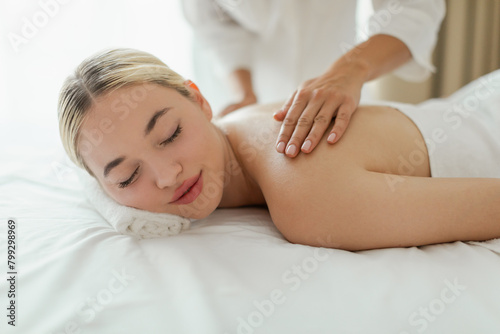 Woman Receiving Back Massage at Luxury Spa