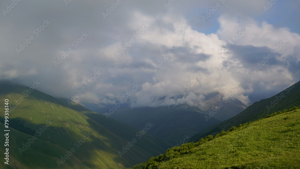 Fototapeta premium Mountains and clouds in dusk