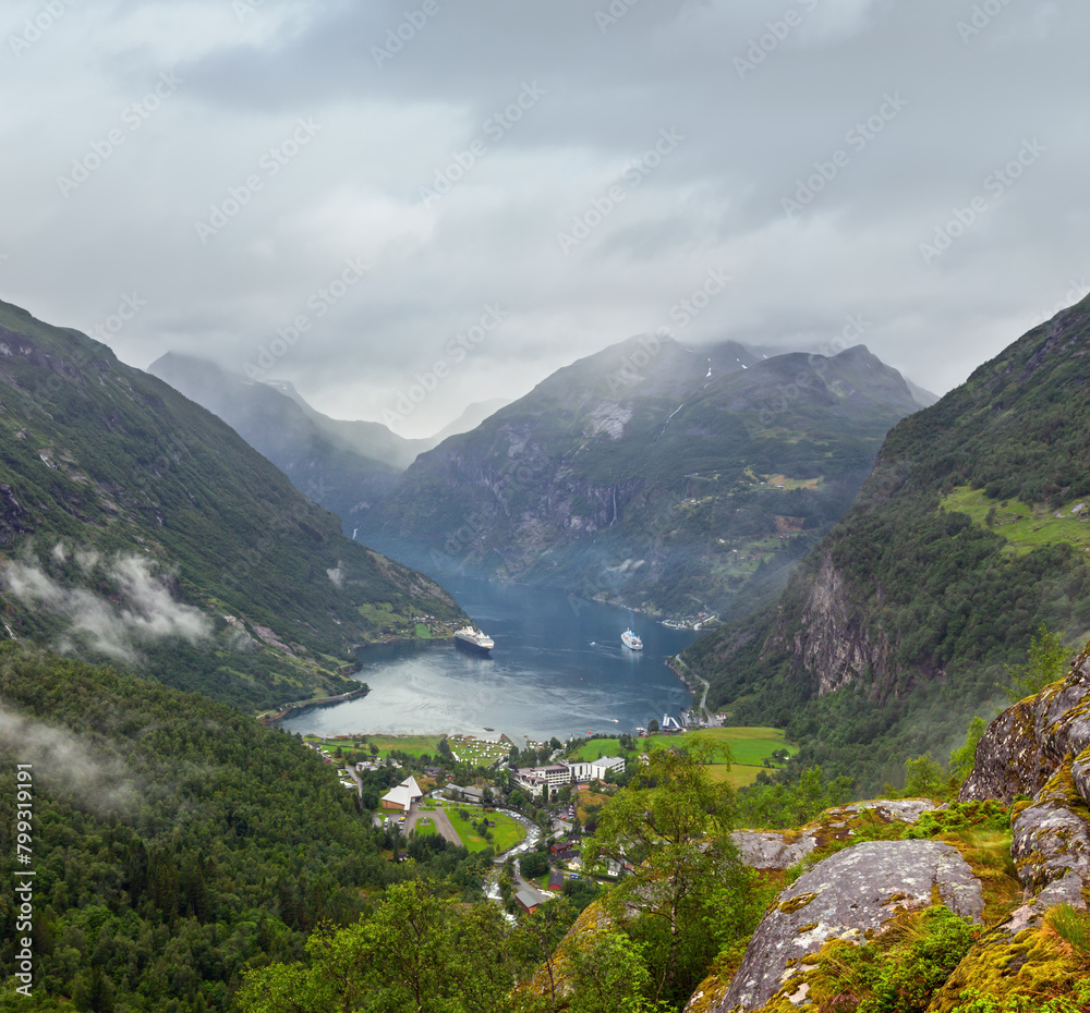 Geiranger Fjord cloudy summer panorama from above Dalsnibba mount, Norway.