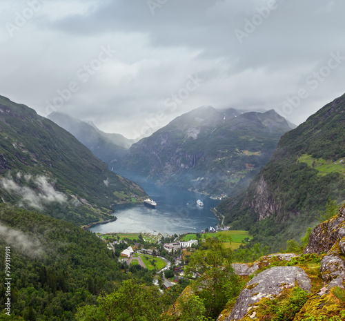 Geiranger Fjord cloudy summer panorama from above Dalsnibba mount  Norway.