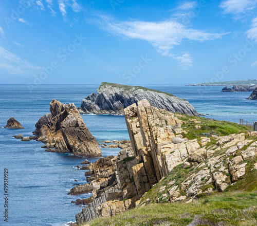 Atlantic ocean rocky coastline near Portio Beach, (Pielagos, Cantabria, Spain) photo