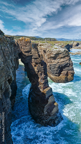 Natural rock arches on Cathedrals beach in low tide (Cantabric coast, Lugo (Galicia), Spain). photo