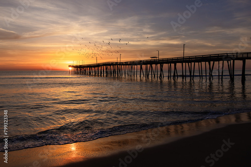 sunrise at the pier With birds flying over