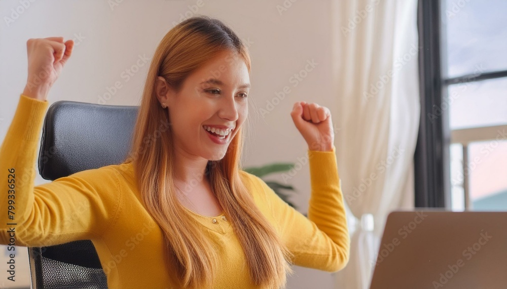  Startup young woman very happy and excited doing winner gesture with arms raised sitting on office
