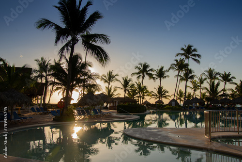 Pretty swimming pool at sunrise in a large hotel in Punta Cana in the Dominican Republic