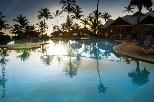 Pretty swimming pool at sunrise in a large hotel in Punta Cana in the Dominican Republic