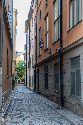 Sweden Stockholm traditional building  lantern  empty narrow alley  Gamla Stan Old Town. Vertical