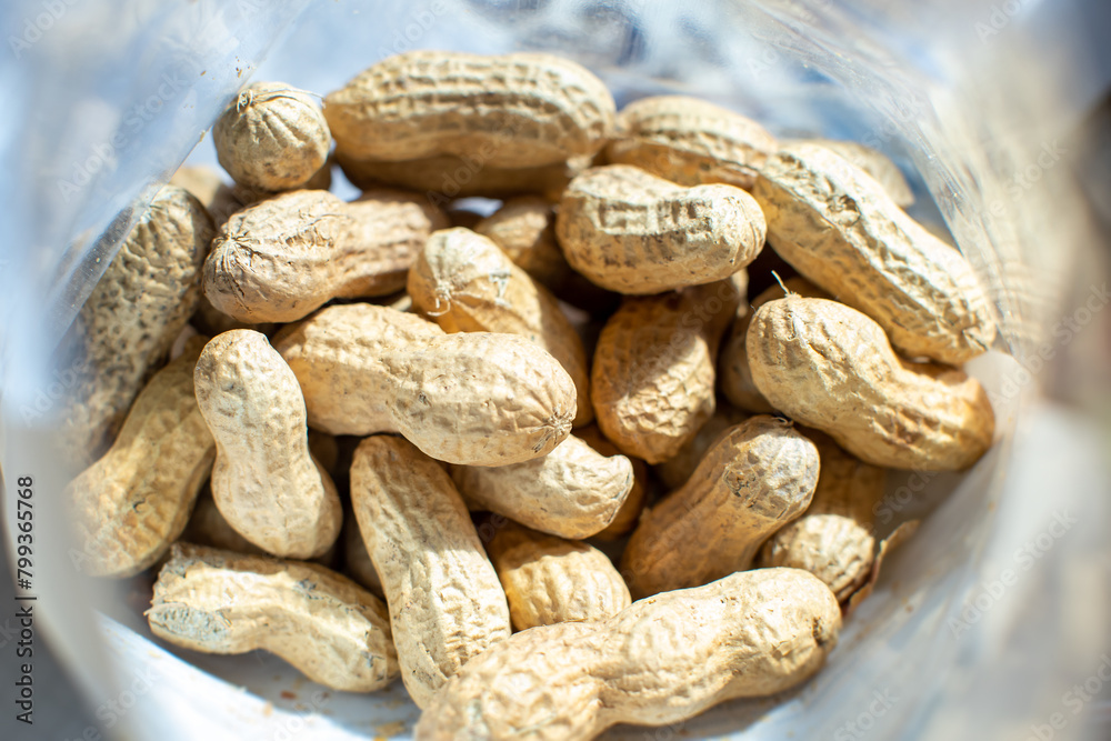 top view of bag of raw peanuts on table top view of bag of raw peanuts on table