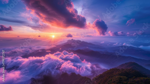 A beautiful mountain range with a pink and orange sky © ART IS AN EXPLOSION.