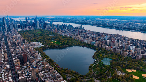 Scenic view of Central Park in the cityscape of New York, the USA. Aerial perspective. Enormous city panorama at sunset.