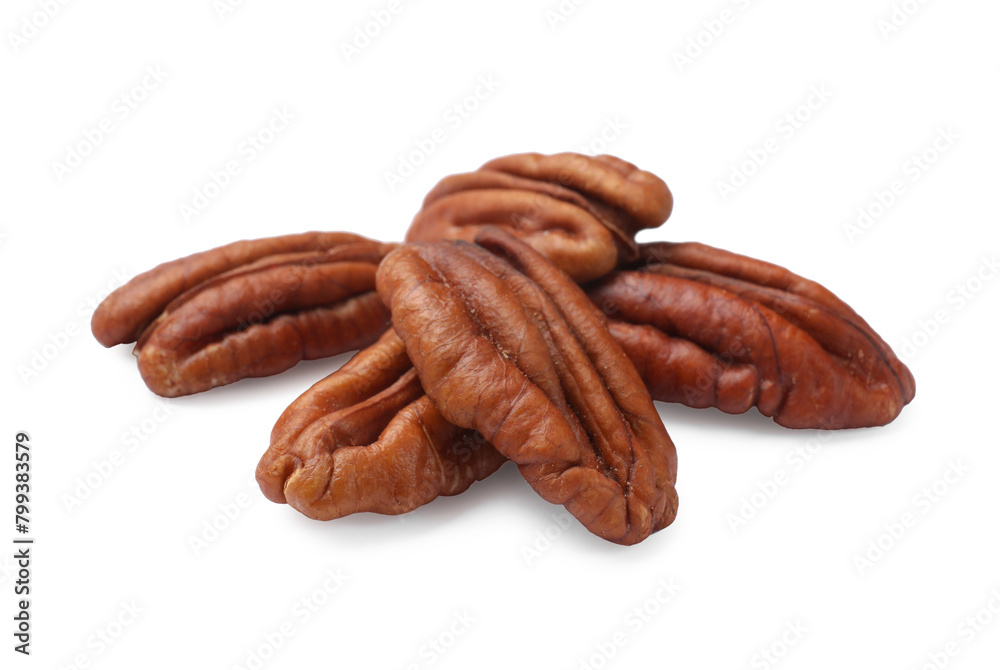 Many tasty pecan nuts isolated on white