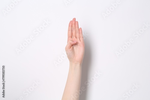 Woman showing open palm on white background  closeup
