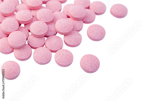 Heap of pink tablets isolated on a transparent background. Close up. Stock photo.