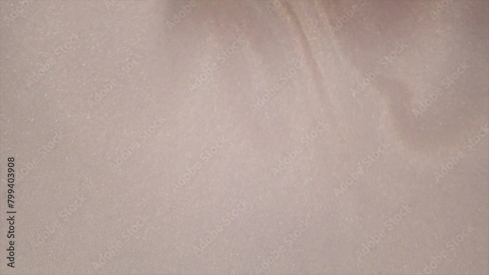 Abstract White background with defocused glitter. Festive monochromatic shiny glitter texture. Abstract White background with defocused glitter. Festive monochromatic shiny glitter texture.