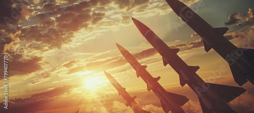 The fired missiles fly towards the target. Rockets in the sky at sunset. Missile defense. Missile attack concept