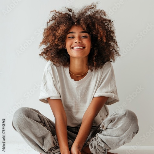 Young Girl Sitting on Floor Smiling