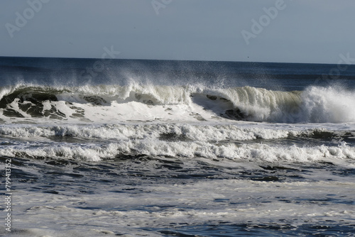Ocean waves crashing off the beach 
