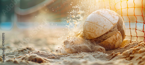 Volleyball ball flew over the net in a cloud of sand, competition on the beach photo