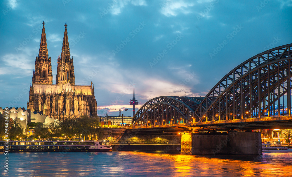 The Cologne Cathedral and Hohenzollern Bridge at night