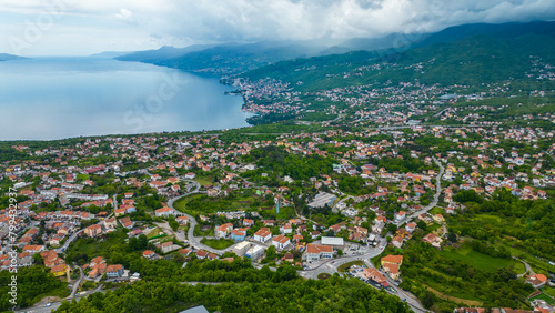 Kastav, a charming town perched on a hill overlooking the Adriatic Sea near Opatija, Croatia, offers a picturesque setting steeped in history and natural beauty captured by drone