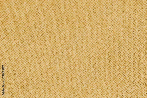 Plain yellow velor upholstery fabric, jacquard with fine diamond texture background. Close up, macro cloth textile surface. Wallpaper, backdrop with copy space