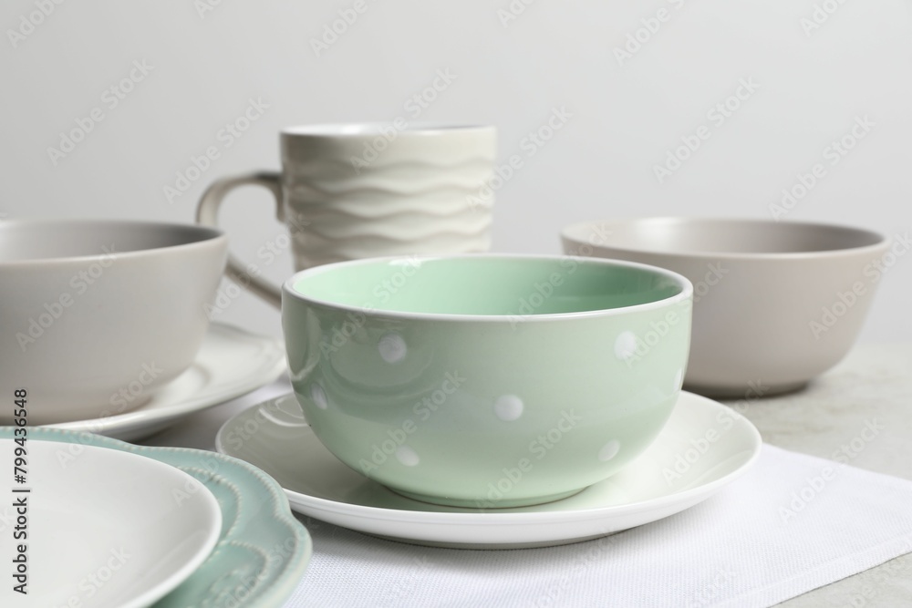 Beautiful ceramic dishware and cup on table Beautiful ceramic dishware and cup on table