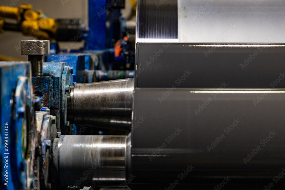 Forging Brilliance: Close-Up of Metal Roll on Industrial Machine Forging Brilliance: Close-Up of Metal Roll on Industrial Machine