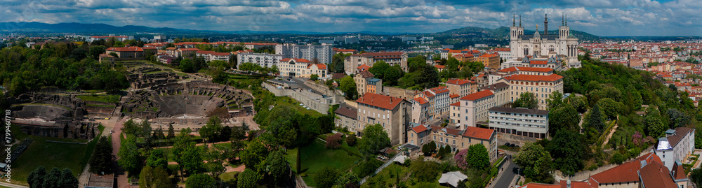 Obraz premium Aerial view of Ancient Theatre of Fourvière, and The Odeon of Lyon. France. it was an ancient Roman theatre inscribed on the UNESCO. In the background on a hill the Basilica of Notre-Dame de Fourvière