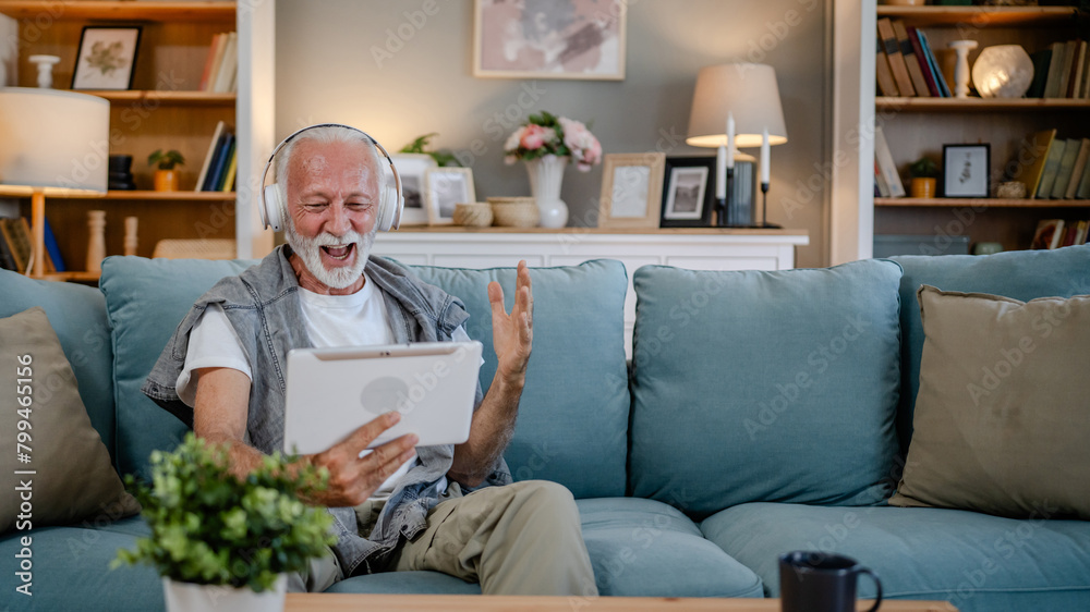 One senior man use digital tablet to watch movie or have a video call One senior man use digital tablet to watch movie or have a video call